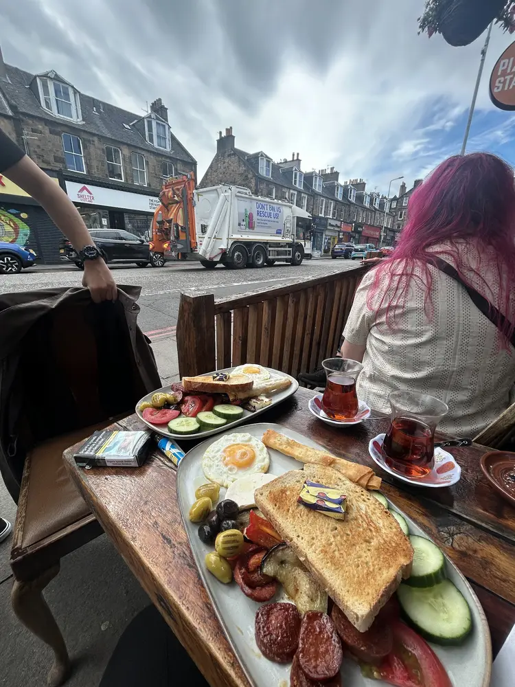 Turkish breakfast and two glasses of çay on the outdoor terrace, Dalry Road behind